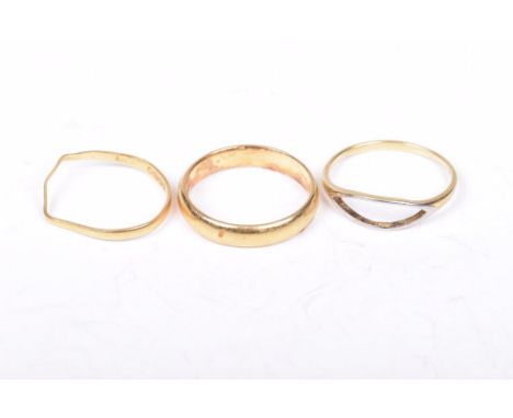 Two 22ct gold bandsBoth of plain form, one very misshapen, on 18ct gold open work ring (3) weight combined 6.5g 