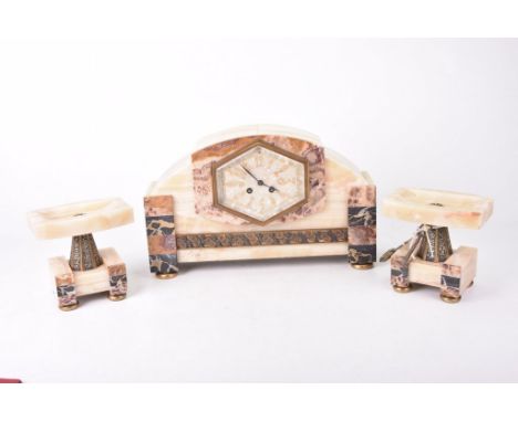 An Art Deco marble and slate mantel clock garnitureThe domed architectural case inset with various panels encircling a hexago