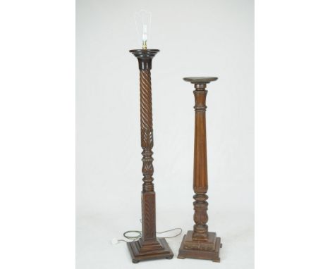 A 19th Century carved mahogany lamp standard and a mahogany torchere The lamp standard with a spirally lobed and acanthus lea