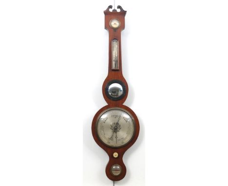 A late 19th Century mahogany banjo aneroid barometerThe swan neck pediment extending to silvered dial with glazed thermometer