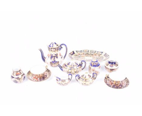 A Collection of Royal Crown Derby Imari pattern miniature itemsTo include coffee pot, teapot, two teacups and saucers, hexago