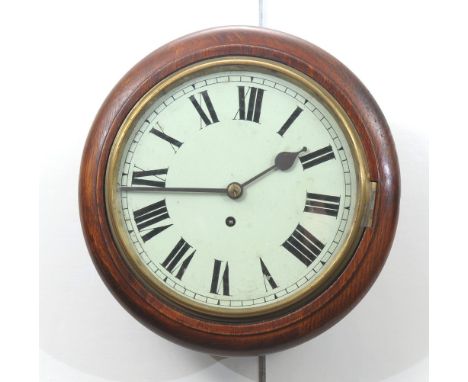 An early 20th Century oak cased fusee wall clockThe glazed white enamel dial with black Roman numerals and bevelled wooden su