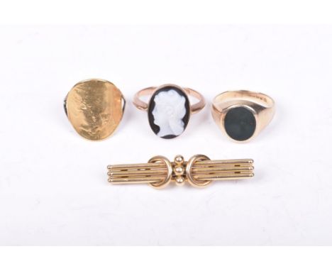 A 9ct gold bloodstone signet ringTogether with, a 9ct rose gold cameo ring, a half sovereign ring and a 15ct gold bar brooch,