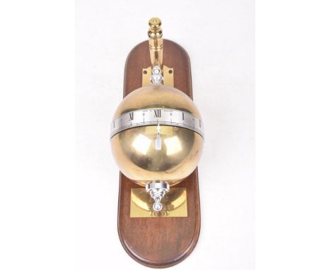 A Dent rolling/falling ball clockThe wooden plaque adorned with gilt suspension bracket, hanging a gilt and silver globe time