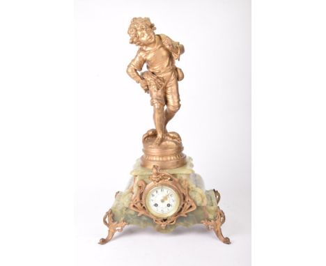 A late 19th Century French mantel clockThe stepped architectural green onyx base with gilt metal swept supports surmounted by