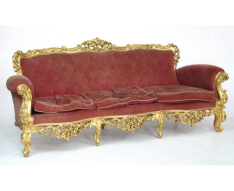 A late 19th Century Italian giltwood sofaThe carved wooden upper top rail with carved acanthus and rocaille designs, raised o
