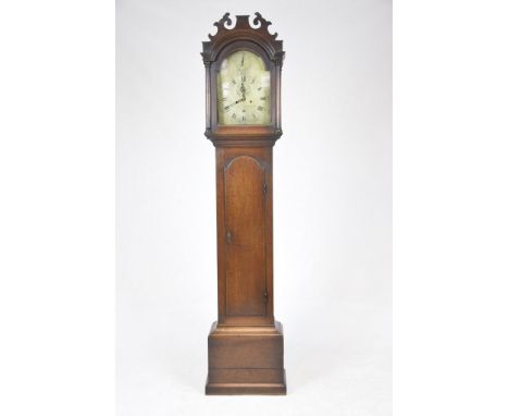 A George III oak cased longcase clock by Benjamin Lockwood, SwaffhamWith a shaped fret work pediment over a break arch twelve