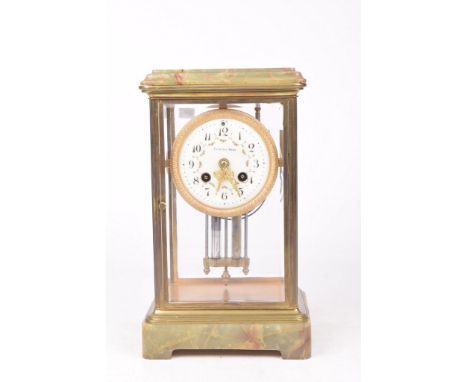 A late 19th Century French 8-day mantel clockThe four-glass clock flanked by green onyx mounts, the white enamelled drum dial