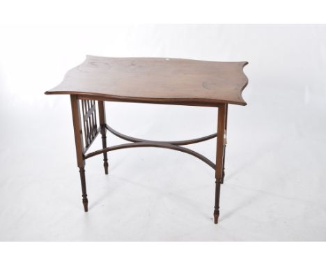 An Edwardian inlaid mahogany occasional tableThe shaped and cross banded top supported on lattice work panels and four legs o