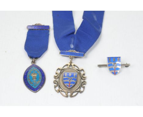 A collection of Cheshire County Council silver medals and a broochBoth medals inscribed and dated, with blue and red enamel d