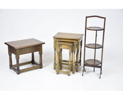A nest of three oak tables, oak occasional table and oak cake standThe nest supported on ring turned baluster legs, the occas