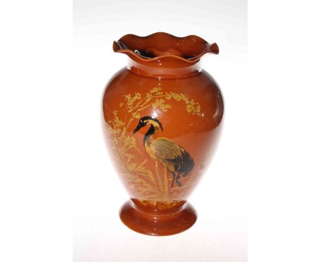 Linthorpe Pottery brown glazed vase, having painted decoration of heron in river-scape, shape no. 1841, 28cm.