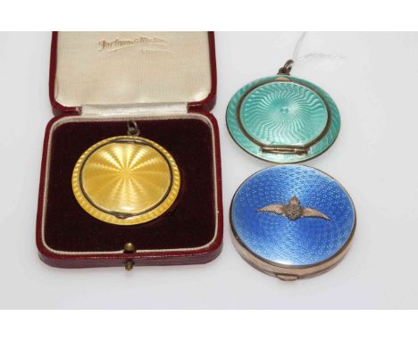 RAF silver and blue enamel compact, Birmingham 1931, 4.5cm diameter, and two silver and overall enamel pendant.