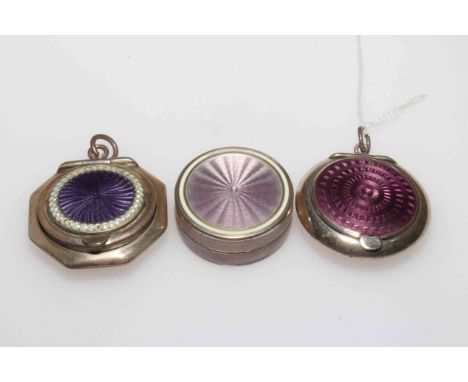 Three small purple/mauve enamel boxes, two with hinged lids, Birmingham 1920/21, each approximately 3.5cm diameter.