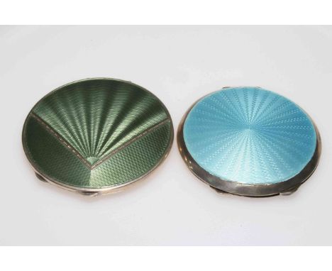 Two silver and enamel compacts, one with fan design green enamel, Birmingham 1934, and sky blue enamel, Birmingham 1959, both