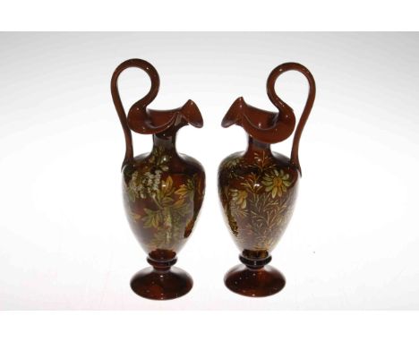 Pair Linthorpe Pottery Florence Minto and Clara Pringle decorated ewers, shape no. 1936, 28.5cm.