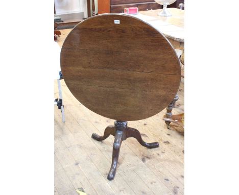 19th Century oak snap top supper table on tripod base, 72cm by 82cm diameter.