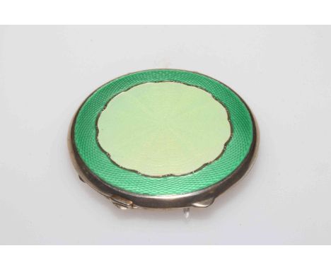 Silver and enamel compact in two colour green, Birmingham 1944, 6.5cm diameter.