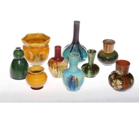 Collection of nine Linthorpe Pottery and other small vases, including shape no. 1225 and 811.