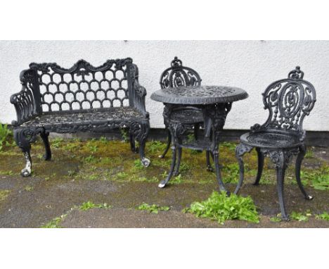 CAST IRON GARDEN FURNITURE, including two-seater bench, circular table and pair of chairs (4)