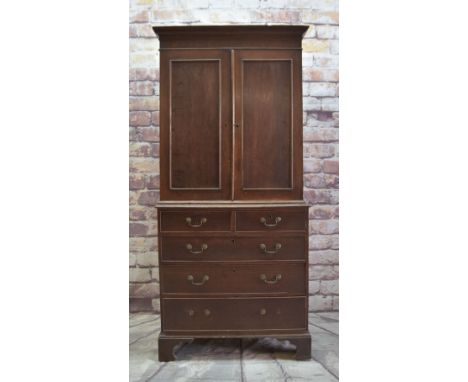 19TH CENTURY OAK LINEN PRESS, of narrow proportions, panelled cupboard enclosing four slides, on a chest base of five drawers