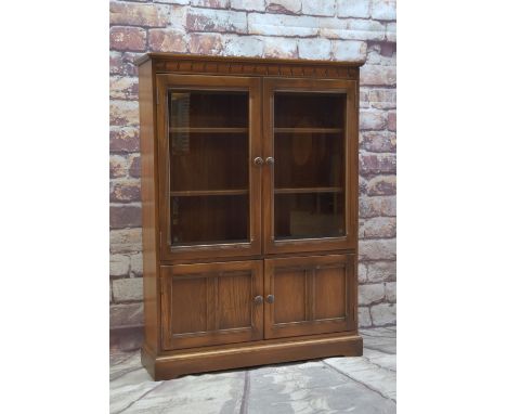 ERCOL ELM BOOKCASE, with glazed cupboard above panelled doors, 137.5h x 101w x 29cms