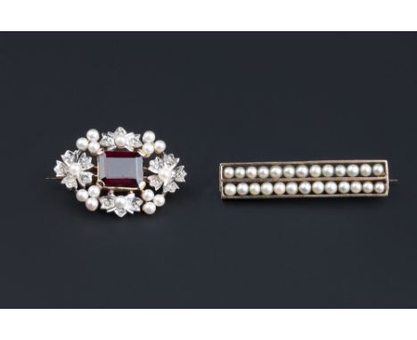 A GARNET, DIAMOND AND SEED PEARL SET BROOCH, the central rectangular step-cut garnet framed by diamond set flowerheads and fo