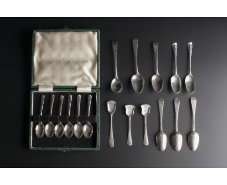 A PAIR OF IRISH SILVER TEASPOONS with cast finials depicting apostles; a pair of silver sugar tongs; two silver teaspoons; an