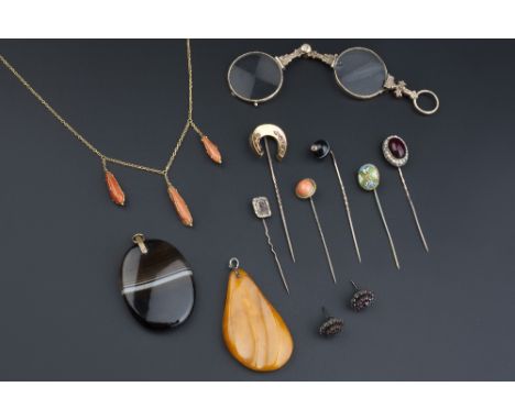 A COLLECTION OF JEWELLERY, comprising six assorted stick pins, a coral pendant necklace, a collection of loose coral beads, a