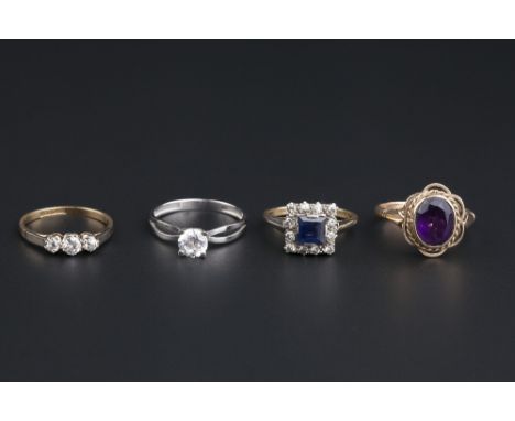 FOUR GEM SET DRESS RINGS, comprising a sapphire and diamond square cluster ring, stamped '18ct & plat', ring size M½, a diamo