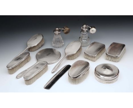 TWO SILVER MOUNTED GLASS PERFUME ATOMISERS, a silver backed five piece dressing table set, three similar brushes, a comb and 