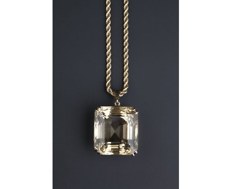 A CITRINE SINGLE STONE PENDANT ON CHAIN, the rectangular step-cut citrine with canted corners, in double-claw setting, suspen