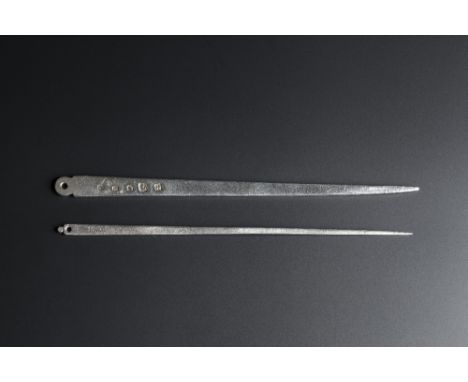 A SILVER MEAT SKEWER of plain tapering form with ring handle, Chester 1776-7 by Richard Richardson III, 22cm long; and a furt