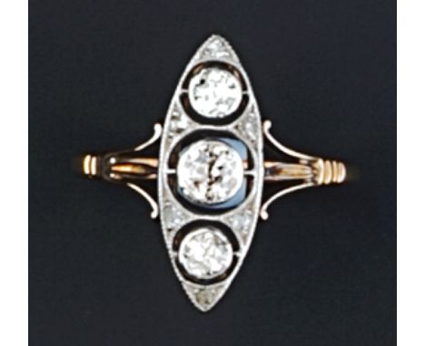A DIAMOND PANEL RING, the pierced navette-shaped panel millegrain set with three old-cut diamonds, framed by smaller diamond 