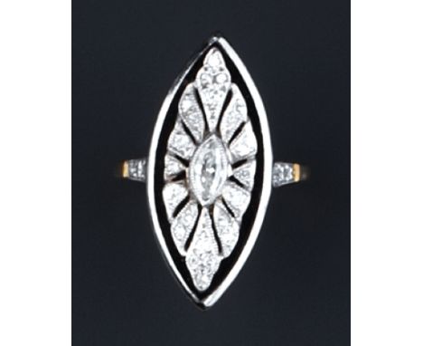 A DIAMOND AND ONYX PANEL RING, the navette-shaped onyx panel applied with a pierced motif, highlighted with marquise, brillia