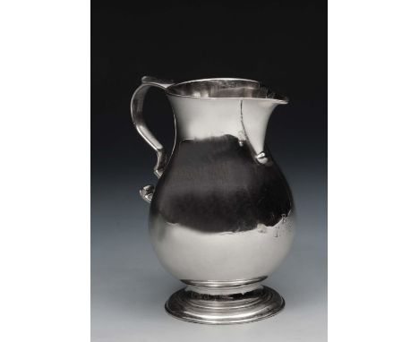 A GEORGE III SILVER BALUSTER SHAPED CREAM JUG with sparrow beak pourer and with a double 'C' scrolled handle, London 1739-40,