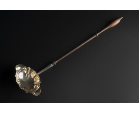 A SILVER PUNCH LADLE with shaped bowl and turned wooden handle, London 1759-60, maker's mark rubbed, 33cm long