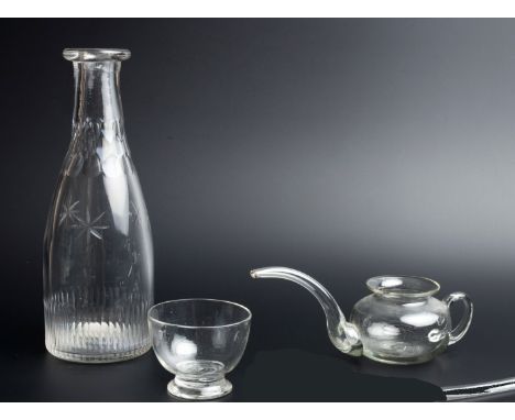 A LATE 18TH CENTURY GLASS CARAFE with faceted and star cut decoration, 24.2cm high; a 19th century glass oil lamp filler; and