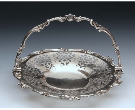 A VICTORIAN SILVER SWING HANDLED CAKE BASKET by Henry Wilkinson & Co, Sheffield 1875, having pierced and engraved decoration 