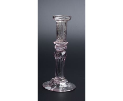 AN 18TH CENTURY GLASS TAPER STICK of eight sided Silesian form on domed foot, 13.8cm high