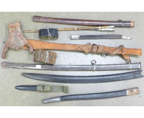 A Spike bayonet, a swagger stick with Kenya Prisons plated top, a shotgun ammunition belt and one other leather belt with gun