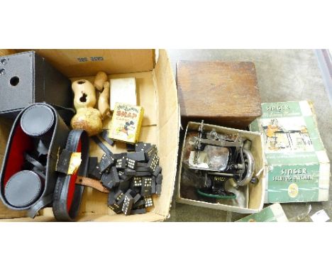 A child's Singer sewing machine, boxed, a pair of Prinz binoculars, a box camera, playing cards including Walt Disney snap, e