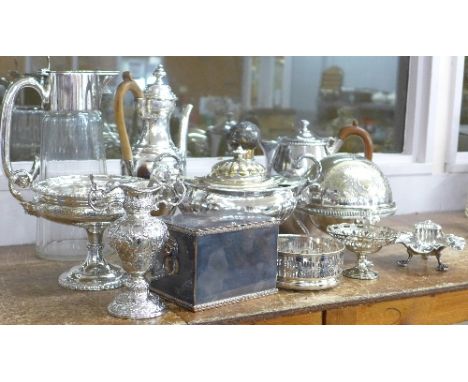 A collection of plated ware including a pedestal tureen, comport, claret jug, caddy, coaster, chocolate pot, etc., (glass a/f