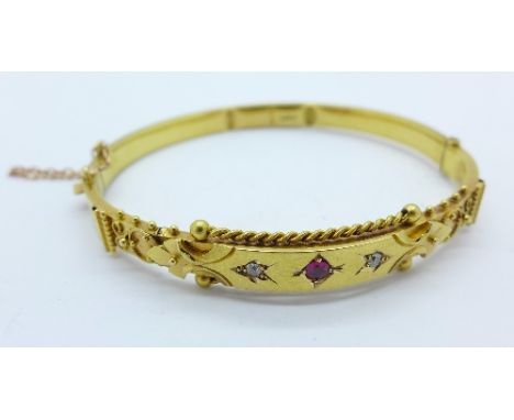A 15ct gold, ruby and diamond bangle, Chester 1906, 11.5g, (a/f, dented)