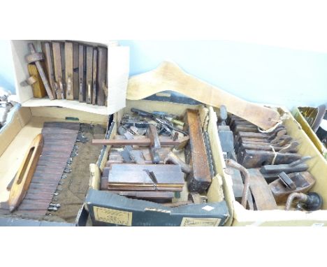 Three boxes of woodworking planes and other woodworking tools including drill bits, etc.