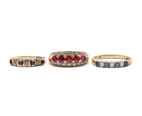 Three 9ct gold rings, comprising a sapphire and diamond half eternity ring, Birmingham, a three row fracture filled ruby and 