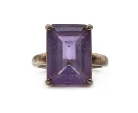 A silver single stone amethyst ring, by Tiffany &amp; Co., an emerald cut amethyst, approximately 16 x 12mm, claw set to a ta