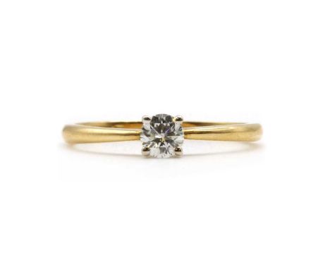 An 18ct gold single stone diamond ring, a round brilliant cut diamond, with an estimated weight of approximately 0.29ct, claw