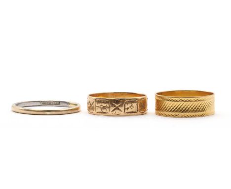 Three gold wedding rings,comprising an 18ct gold patterned ring, Birmingham 1881, a 3.01g, a gold patterned flat section ring