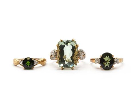 Three 9ct gold rings,comprising a prasiolite quartz and diamond ring, a moldavite and diamond ring, and a chrome diopside and